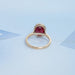 back view of oval cut ruby lab gemstone bezel set engagement ring