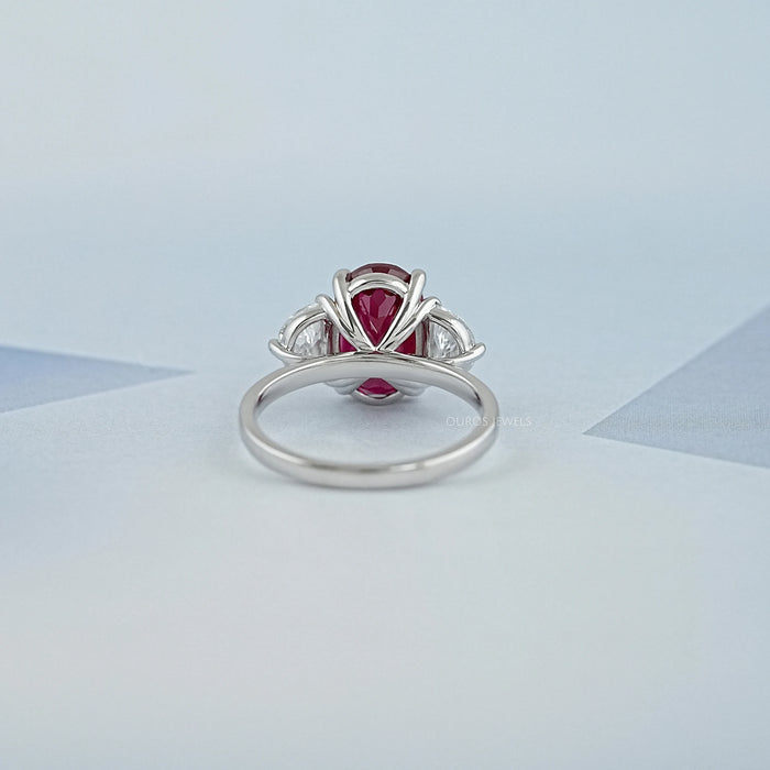 back view of oval ruby gemstone and half moon diamond 3 stone engagement ring