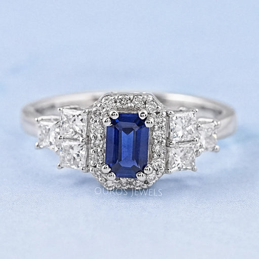 sapphire emerald diamond engagement ring with halo accent's front view