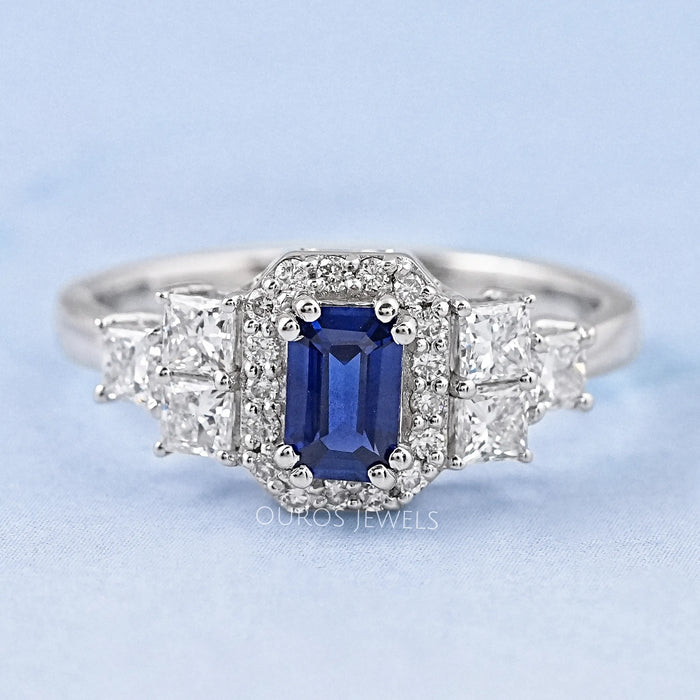 sapphire emerald diamond engagement ring with halo accent's front view