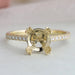 front view of solitaire accent diamond semi-mount engagement ring on grey fabric