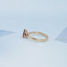 side view of garnet pear-cut gemstone solitaire engagement ring