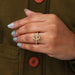 solitaire accent oval-shaped semi-mount engagement ring on model's finger