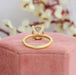 back view of solitaire accent oval-shaped semi-mount engagement ring on jewelry box