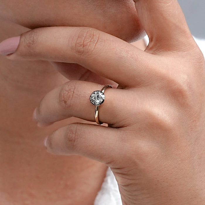 black coated old eauropean round lab diamond ring on model's finger