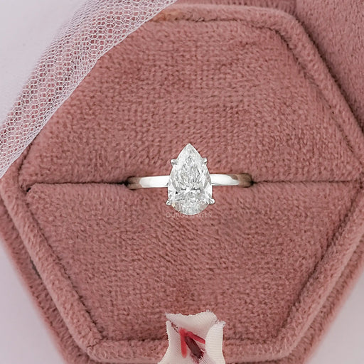 pear cut lab diamond solitaire engagement ring in jewelry box