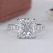 front view of square cushion-cut lab diamond eternity engagement ring on grey fabric