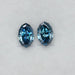 front view of step cut blue oval lab grown diamonds pair