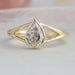 top view of step cut pear diamond bezel set engagement ring