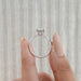 close view of emerald cut lab diamond solitaire engagement ring