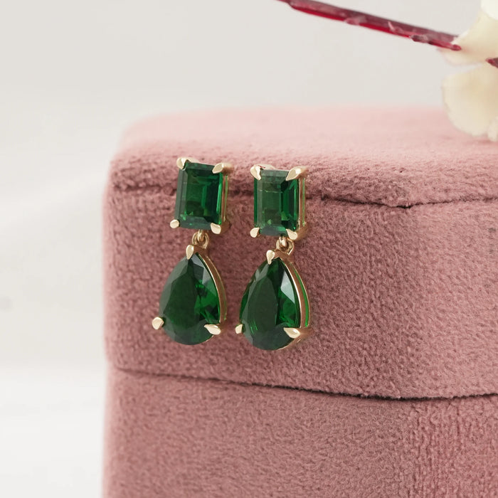 side view of green emerald and teardrop gemtsone flat back drop earrings