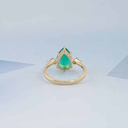 Green Pear And Kite Cut Three Stone Engagement Ring