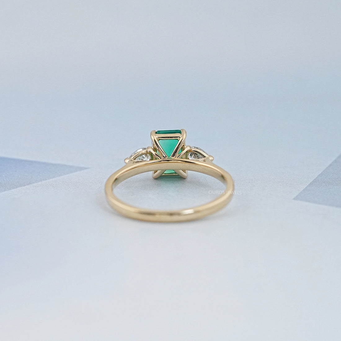 Emerald Gemstone And Pear Diamond Trio Engagement Ring Rings
