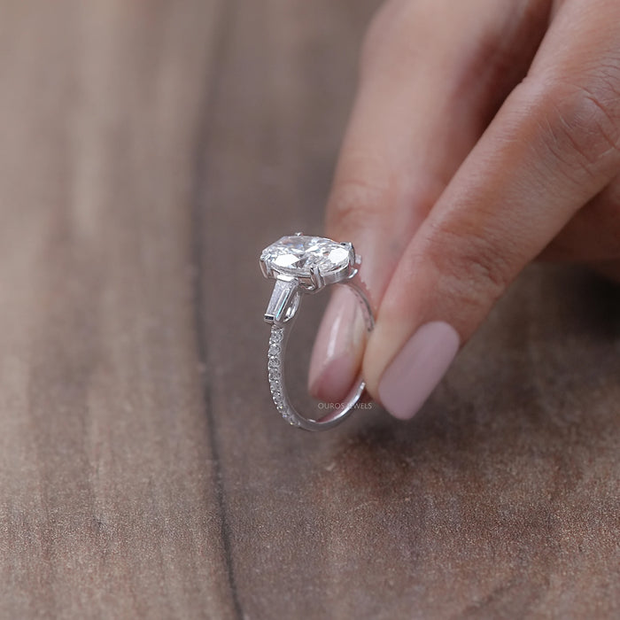 oval cut lab diamond three stone engagement ring's side view