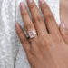 pink radiant-cut lab diamond three-stone colored engagement ring in finger