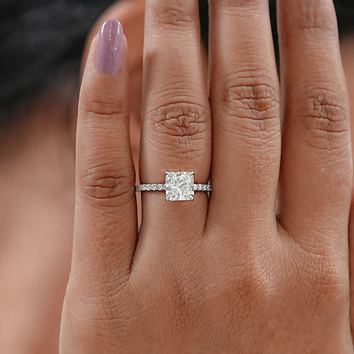front view of square radiant-cut diamond solitaire accent wedding ring in finger