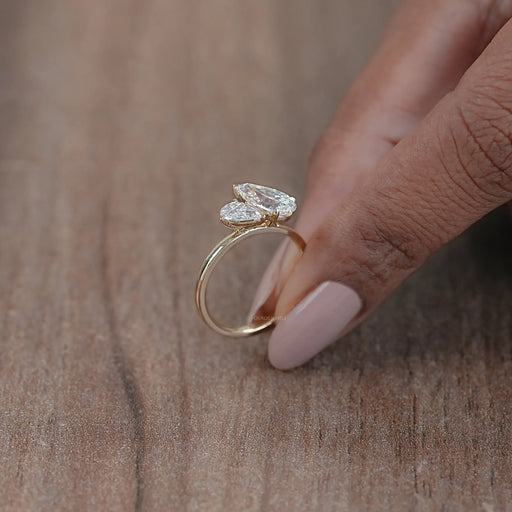 side view of two pear-cut lab-grown diamond toi et moi engagement ring
