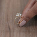side view of two pear-cut lab-grown diamond toi et moi engagement ring