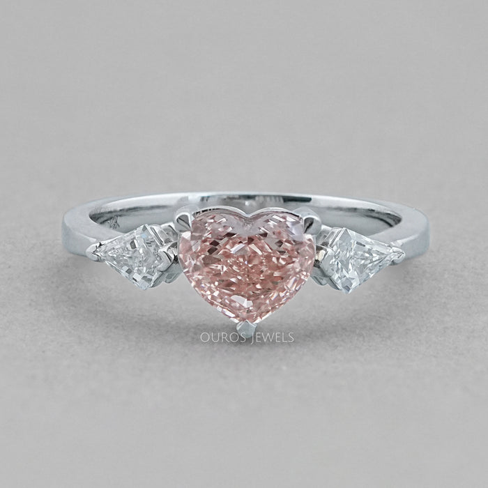 front view of fancy pink heart cut lab diamond 3 stone engagement ring