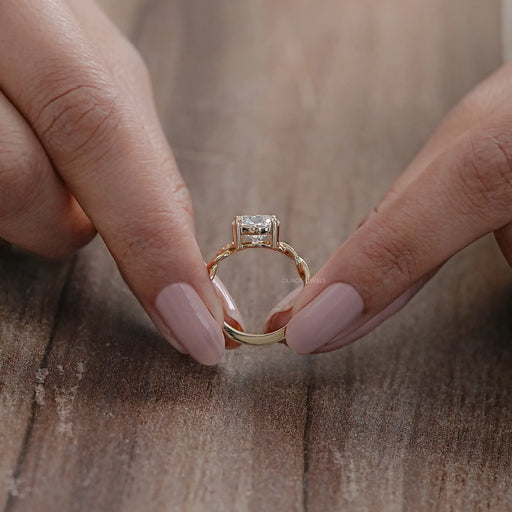 close view of twisted round-cut lab diamond solitaire accent anniversary ring