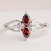 front view of red pear-cut lab diamond two-stone dainty colored wedding band