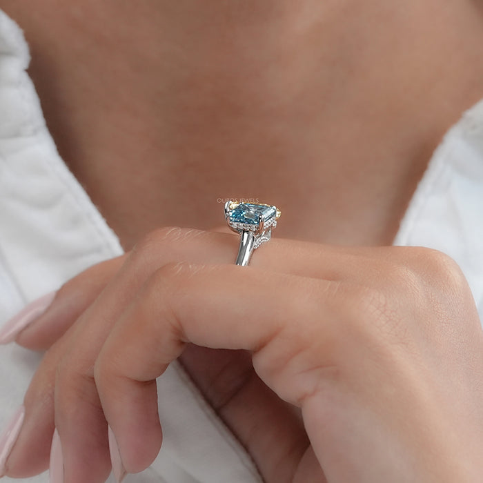 asscher and pear-cut diamond hidden halo toi et moi engagement ring on model's finger