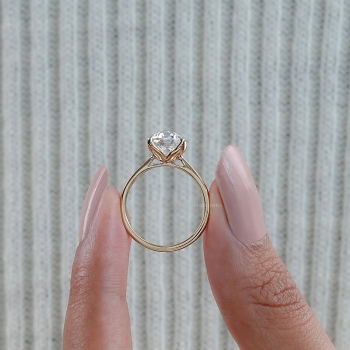 close up with side angle view old mine cushion diamond petal engagement ring