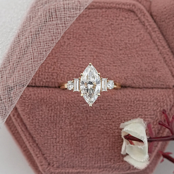 marquise and baguette cut diamond five stone engagement ring in jewelry box