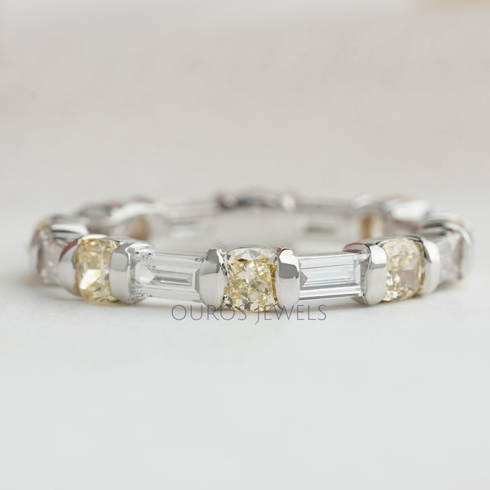 front view of yellow cushion and baguette lab grown diamond eternity wedding band