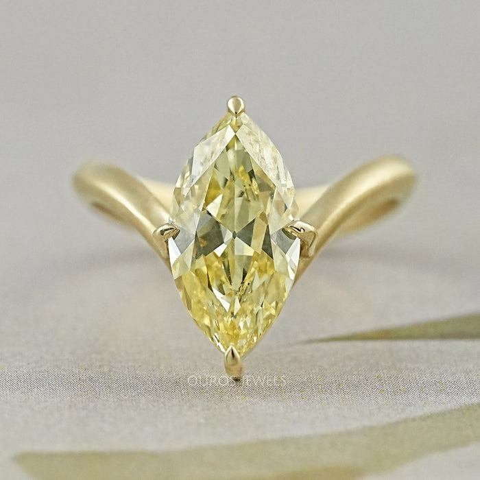 front view of yellow old mine marquise diamond V-shape solitaire colored wedding ring