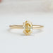 front view of yellow oval cut lab diamond engagement ring