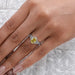 yellow oval cut diamond split shank halo engagement ring in finger view