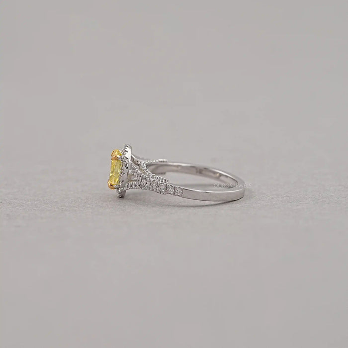 side view of yellow oval cut diamond split shank halo engagement ring