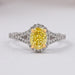 front view of yellow oval cut diamond split shank halo engagement ring