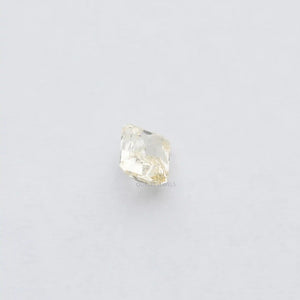 2.15 Carat Fancy Intense Yellow Radiant Cut Lab Diamond displayed on white surface.