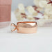 side view of east west criss cut lab diamond men's engagement ring in rose gold