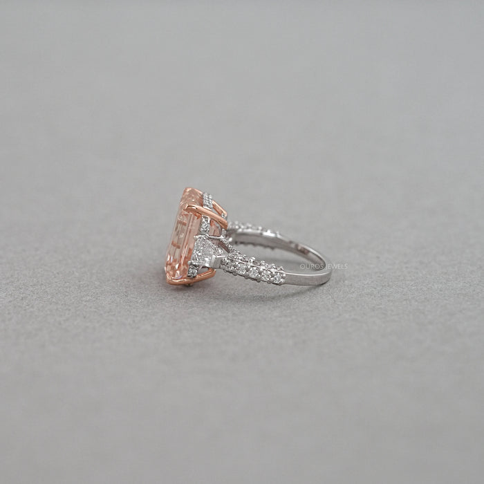 side view of pink emerald diamond three-stone hidden halo colored engagement ring