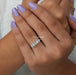 oval cut lab grown diamond five stone wedding ring on model's finger