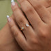 pear and round-cut lab-grown diamond open cuff wedding band on model's finger