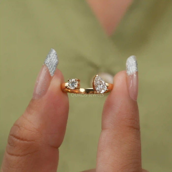 close view of pear and round-cut lab-grown diamond open cuff wedding band