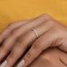pink kite-cut lab diamond solitaire accent wedding ring on model's finger
