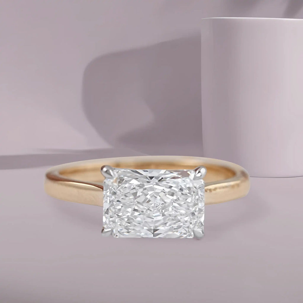 radiant cut diamond east west ring