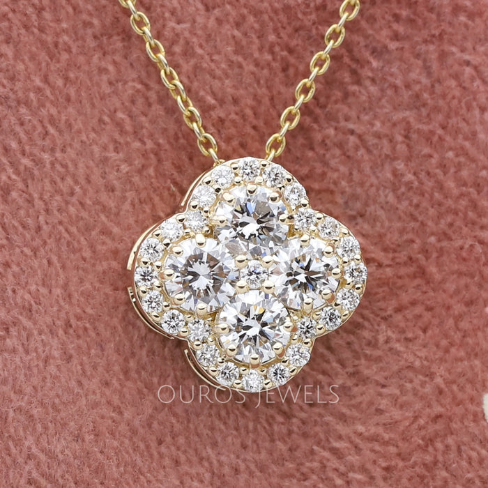 front view of flower shape halo round diamond cluster pendant yellow gold