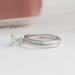 side view of round-cut lab-grown diamond bridal ring set with white gold band