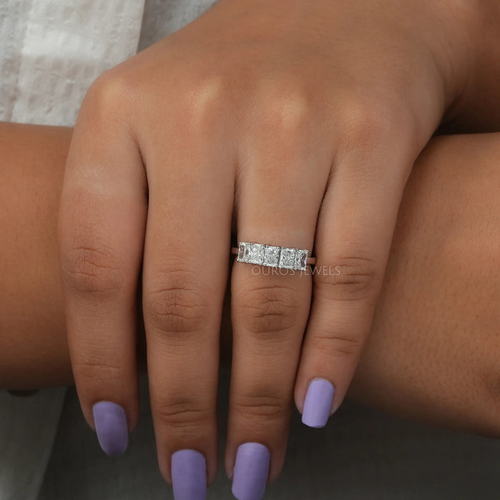 radiant cut lab diamond five stone wedding ring with white gold band in finger