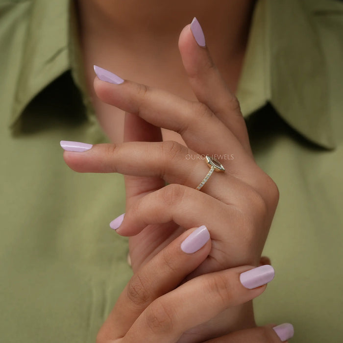 In finger side look of antique solitaire engagement ring