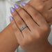 light blue emerald cut lab diamond five stone wedding ring on model's finger