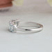 side view of light blue emerald cut lab diamond five stone wedding ring