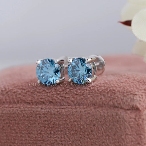 blue round cut diamond claw prong setting stud earrings white gold on box