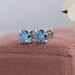 blue round cut diamond claw prong setting stud earrings white gold on box